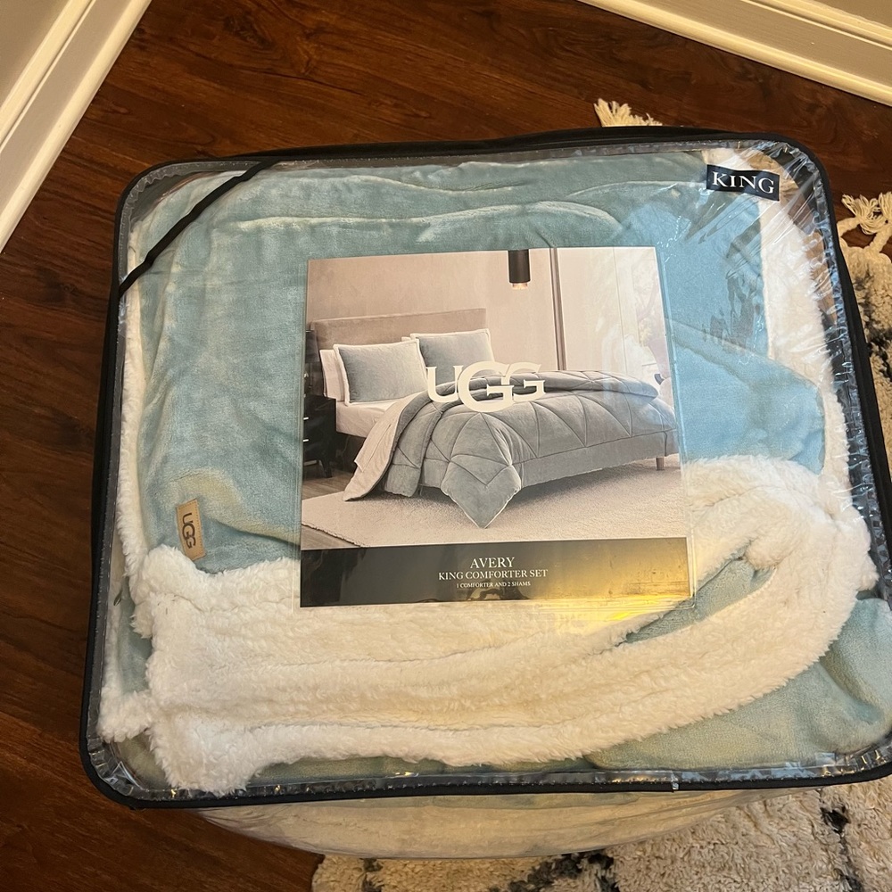Brand new King comforter with 2 shames. Super soft. Soft teal/aqua, cream color